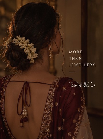 Indian festive styling with jasmine flowers in the hair and a richly embroidered blouse